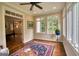 Sunroom with hardwood floors and an abundance of natural light and bedroom access at 223 Old Rome Rd, Kingston, GA 30145