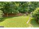 Large level backyard with privacy fence and trimmed green grass at 110 Long Leaf, Peachtree City, GA 30269