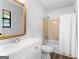 Bathroom featuring a white vanity, an updated mirror, and a shower-tub combination with modern fixtures at 110 Long Leaf, Peachtree City, GA 30269