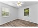 Bright bedroom features new laminate floors, and lots of light from two large windows at 110 Long Leaf, Peachtree City, GA 30269