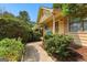 Inviting front entrance with a walkway, shrubbery and covered porch at 110 Long Leaf, Peachtree City, GA 30269