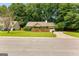 Well-kept suburban home with a fenced front yard and green lawn at 110 Long Leaf, Peachtree City, GA 30269