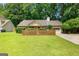 Charming one-story home featuring a wooden fence, attached garage, and lush green lawn at 110 Long Leaf, Peachtree City, GA 30269
