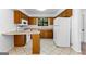 Functional kitchen featuring wood cabinets and standard appliances at 110 Long Leaf, Peachtree City, GA 30269