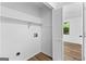 Large laundry room with hookups and storage at 110 Long Leaf, Peachtree City, GA 30269