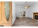 Bright living room with wood floors, ceiling fan, and an open view at 110 Long Leaf, Peachtree City, GA 30269