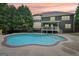 Gorgeous backyard pool with brick trim and lush greenery surrounding the property at 1979 Alcovy Shoals Blf, Lawrenceville, GA 30045
