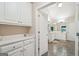 This bathroom features a double vanity and plentiful storage space and an entrance to the water closet at 1979 Alcovy Shoals Blf, Lawrenceville, GA 30045