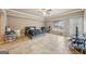 Spacious bedroom with a comfortable bed, tile floors, a desk, and an exterior door at 1979 Alcovy Shoals Blf, Lawrenceville, GA 30045