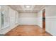 Empty formal dining room with hardwood flooring, wainscoting and coffered ceiling at 1979 Alcovy Shoals Blf, Lawrenceville, GA 30045