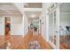 Welcoming foyer with gleaming hardwood floors and natural light highlighting the coffered ceiling detail at 1979 Alcovy Shoals Blf, Lawrenceville, GA 30045