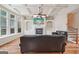 Comfortable living room with fireplace, coffered ceiling, and large windows at 1979 Alcovy Shoals Blf, Lawrenceville, GA 30045