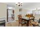 Inviting dining area leading to the living room and kitchen at 12303 Waldrop Pl, Decatur, GA 30034