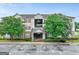 Attractive multi-story condo complex featuring well-maintained landscaping and covered entry at 12303 Waldrop Pl, Decatur, GA 30034