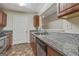 Practical kitchen layout with granite countertops and stainless steel appliances at 12303 Waldrop Pl, Decatur, GA 30034