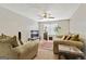 Comfortable living room with neutral tones, ceiling fan, and lots of natural light at 12303 Waldrop Pl, Decatur, GA 30034