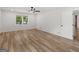 This large bedroom is illuminated by natural light and a ceiling fan at 90 Country Roads Cir, Stockbridge, GA 30281
