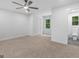 Bedroom with neutral carpet, closet, and en-suite bathroom, offering a private and convenient space at 90 Country Roads Cir, Stockbridge, GA 30281