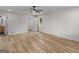 Spacious bedroom with hardwood floors, ceiling fan, and ensuite bathroom access for optimal comfort at 90 Country Roads Cir, Stockbridge, GA 30281