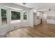 Dining room features bay windows, hardwood floors, and a view of the backyard at 90 Country Roads Cir, Stockbridge, GA 30281