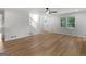 Spacious living room with natural light, a staircase, and modern light-colored wood floors at 90 Country Roads Cir, Stockbridge, GA 30281