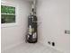 This utility room features a hot water tank and a window at 90 Country Roads Cir, Stockbridge, GA 30281