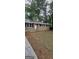 Charming single-story brick home with a metal roof and traditional black shutters at 4059 Canby Ln, Decatur, GA 30035