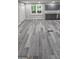 Open-concept living space with stylish flooring and modern kitchen visible at 4059 Canby Ln, Decatur, GA 30035
