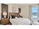 Stylish bedroom features a wood headboard and earth-toned decor, creating a relaxing retreat at 5455 Baybrook Cir, South Fulton, GA 30349