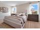 Bedroom showcasing a well-lit space with soft neutral decor, large windows and plush bedding at 5455 Baybrook Cir, South Fulton, GA 30349