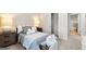 Cozy bedroom featuring neutral colors, plush bedding, and bedside tables with lamps at 5455 Baybrook Cir, South Fulton, GA 30349