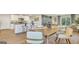 Open-concept dining area adjacent to the kitchen, featuring modern furnishings and natural light at 5455 Baybrook Cir, South Fulton, GA 30349