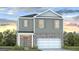 Charming two-story home with gray siding and a brick front, complemented by a well-manicured lawn at 5455 Baybrook Cir, South Fulton, GA 30349