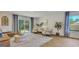 Bright living room with sliding glass doors, stylish furniture, and a view of the backyard at 5455 Baybrook Cir, South Fulton, GA 30349