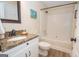 Well-lit bathroom featuring granite counters, white cabinetry, and a shower-tub combination at 482 N Jeff Davis Dr, Fayetteville, GA 30214
