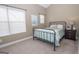 Well-lit bedroom with large window, carpet, and neutral walls at 482 N Jeff Davis Dr, Fayetteville, GA 30214