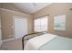 Bedroom with carpet, neutral walls, double closet, and a window at 482 N Jeff Davis Dr, Fayetteville, GA 30214