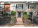 Charming multi-Gathering home featuring a gated front entrance and landscaped yard at 482 N Jeff Davis Dr, Fayetteville, GA 30214