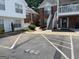 Well-maintained condo building with brick facade, landscaped grounds, and clearly marked parking at 482 N Jeff Davis Dr, Fayetteville, GA 30214