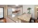 Bright kitchen features a breakfast bar with granite countertops and modern appliances at 482 N Jeff Davis Dr, Fayetteville, GA 30214