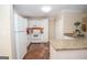 A bright kitchen with a breakfast bar, white cabinets, and stone countertops at 482 N Jeff Davis Dr, Fayetteville, GA 30214
