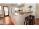 Bright kitchen with breakfast bar, granite countertops, and stainless appliances at 482 N Jeff Davis Dr, Fayetteville, GA 30214
