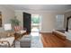 Inviting living room with hardwood floors, and a view to the front door at 482 N Jeff Davis Dr, Fayetteville, GA 30214