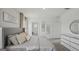 Bright primary bedroom with a large dresser and a door leading to another room at 5451 Baybrook Cir, South Fulton, GA 30349