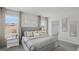 Primary bedroom featuring a king bed, side tables, and two windows with lovely outdoor views at 5451 Baybrook Cir, South Fulton, GA 30349