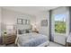 Inviting bedroom with a well-lit window, comfortable decor, and soft bedding at 5451 Baybrook Cir, South Fulton, GA 30349
