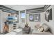 Cozy bonus room with a modern TV, movie-themed decor, and stylish gray and white accents at 5451 Baybrook Cir, South Fulton, GA 30349