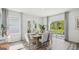 Elegant dining room with ample seating, natural light, and access to the outdoor space at 5451 Baybrook Cir, South Fulton, GA 30349