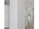 Hallway featuring neutral walls, laminate floors, and white doors leading to other rooms at 5451 Baybrook Cir, South Fulton, GA 30349