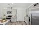 Well-equipped kitchen boasting stainless steel appliances, laminate floors, and plenty of cabinet storage space at 5451 Baybrook Cir, South Fulton, GA 30349